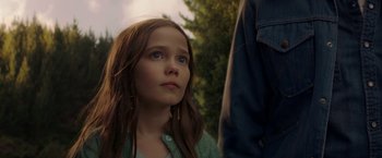 Movie still from “Pete's Dragon” (2016), directed by David Lowery – A young girl looking up at the sky; Close Up shot, Low angle
