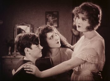 Movie still from “Peter Pan” (1924), directed by Herbert Brenon – A group of people that are in a room together; Medium shot, High angle