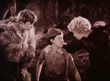 Movie still from “Peter Pan” (1924), directed by Herbert Brenon – A group of young people standing next to each other; Medium shot, High angle