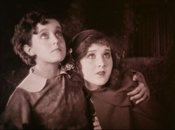 Movie still from “Peter Pan” (1924), directed by Herbert Brenon – Two young girls are looking up at the sky; Close Up shot, Low angle