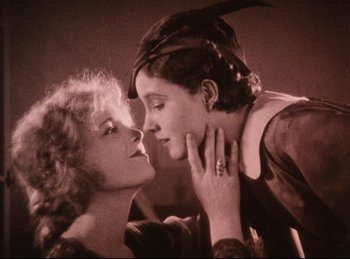 Movie still from “Peter Pan” (1924), directed by Herbert Brenon – Two women are kissing each other on the cheek; Close Up shot, High angle