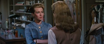Movie still from “Peyton Place” (1957), directed by Mark Robson – A woman looking at herself in the mirror; Close Up shot, Over the shoulder angle