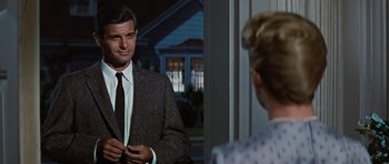 Movie still from “Peyton Place” (1957), directed by Mark Robson – A man and a woman are looking in the same mirror; Medium shot, Over the shoulder angle