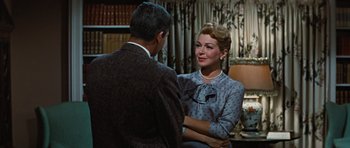 Movie still from “Peyton Place” (1957), directed by Mark Robson – A man and a woman are sitting in front of each other; Medium shot, Over the shoulder angle