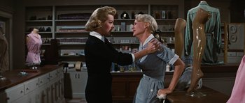 Movie still from “Peyton Place” (1957), directed by Mark Robson – Two women are fighting in a kitchen; Medium shot, Low angle