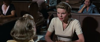 Movie still from “Peyton Place” (1957), directed by Mark Robson – A woman sitting in front of another woman at a table; Close Up shot, Over the shoulder angle