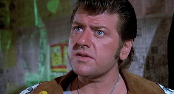 Movie still from “Phantom of the Paradise” (1974), directed by Brian De Palma – A person wearing a jacket; Close Up shot, Low angle