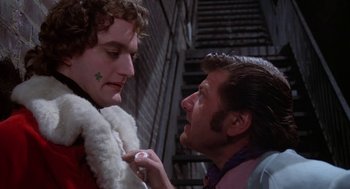 Movie still from “Phantom of the Paradise” (1974), directed by Brian De Palma – A man and a woman looking at one another; Close Up shot, Over the shoulder angle