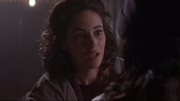 Movie still from “Phantoms” (1998), directed by Joe Chappelle – A person talking to another person; Close Up shot, Over the shoulder angle