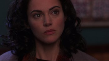 Movie still from “Phantoms” (1998), directed by Joe Chappelle – A person looking at the camera; Close Up shot, Over the shoulder angle