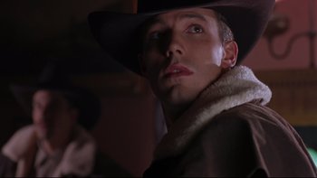 Movie still from “Phantoms” (1998), directed by Joe Chappelle – A person wearing a cowboy hat; Close Up shot, Low angle