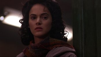 Movie still from “Phantoms” (1998), directed by Joe Chappelle – A person wearing a scarf; Close Up shot, Over the shoulder angle