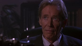 Movie still from “Phantoms” (1998), directed by Joe Chappelle – An older man in a suit and red tie; Close Up shot, Over the shoulder angle