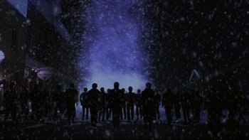 Movie still from “Phantoms” (1998), directed by Joe Chappelle – A group of people standing in the snow; Extreme Wide shot, Low angle