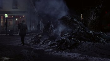 Movie still from “Phantoms” (1998), directed by Joe Chappelle – A pile of rubble in the middle of the night; Extreme Wide shot, Low angle