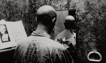 Movie still from “Pi” (1998), directed by Darren Aronofsky – A bald man looking in the mirror in front of a mirror; Close Up shot, Over the shoulder angle