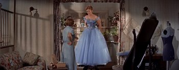 Movie still from “Picnic” (1955), directed by Joshua Logan – A woman in a blue dress standing next to another woman in a blue dress; Wide shot, Low angle