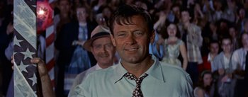Movie still from “Picnic” (1955), directed by Joshua Logan – A person wearing a shirt and a tie; Close Up shot, Low angle