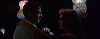 Movie still from “Picnic” (1955), directed by Joshua Logan – A man and a woman face to face in the dark; Close Up shot, Low angle