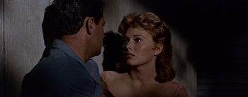 Movie still from “Picnic” (1955), directed by Joshua Logan – A man and a woman looking into each others eyes; Close Up shot, Over the shoulder angle