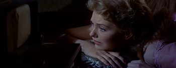 Movie still from “Picnic” (1955), directed by Joshua Logan – A person sitting in a room; Close Up shot, High angle