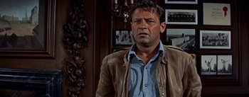 Movie still from “Picnic” (1955), directed by Joshua Logan – A person standing in a room; Close Up shot, Low angle