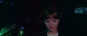 Movie still from “Pierrot le Fou” (1965), directed by Jean-Luc Godard – A person wearing a suit; Close Up shot, Low angle