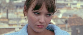 Movie still from “Pierrot le Fou” (1965), directed by Jean-Luc Godard – A person wearing a blue towel; Close Up shot, High angle