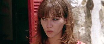 Movie still from “Pierrot le Fou” (1965), directed by Jean-Luc Godard – A person wearing a dress; Close Up shot, Low angle