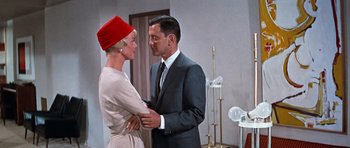 Movie still from “Pillow Talk” (1959), directed by Michael Gordon – A man and a woman standing next to each other in a room; Medium shot, Low angle