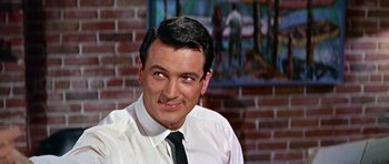 Movie still from “Pillow Talk” (1959), directed by Michael Gordon – A person wearing a shirt and a tie; Close Up shot, Low angle
