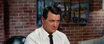 Movie still from “Pillow Talk” (1959), directed by Michael Gordon – A person wearing a shirt and a tie; Close Up shot, Low angle