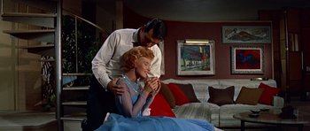 Movie still from “Pillow Talk” (1959), directed by Michael Gordon – A man and a woman in a living room; Medium shot, Low angle