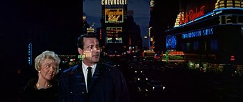 Movie still from “Pillow Talk” (1959), directed by Michael Gordon – A man standing in the middle of a street at night; Medium shot, Low angle