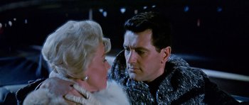 Movie still from “Pillow Talk” (1959), directed by Michael Gordon – A man and a woman looking at one another; Close Up shot, Over the shoulder angle