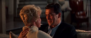 Movie still from “Pillow Talk” (1959), directed by Michael Gordon – A man and a woman talking to each other; Close Up shot, Low angle