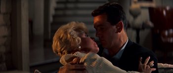 Movie still from “Pillow Talk” (1959), directed by Michael Gordon – A man and a woman are kissing in the dark; Close Up shot, Low angle