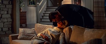 Movie still from “Pillow Talk” (1959), directed by Michael Gordon – A man and a woman laying on a couch next to each other; Medium shot, Low angle