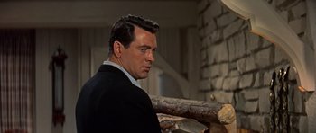 Movie still from “Pillow Talk” (1959), directed by Michael Gordon – A person wearing a suit and tie; Close Up shot, Low angle