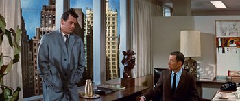 Movie still from “Pillow Talk” (1959), directed by Michael Gordon – Two men sitting in front of a window in a room; Medium shot, Over the shoulder angle