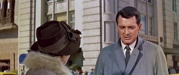 Movie still from “Pillow Talk” (1959), directed by Michael Gordon – A man and a woman standing next to each other outside; Close Up shot, Over the shoulder angle