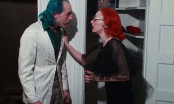 A man and a woman with red hair and blue eyes