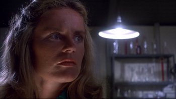 Movie still from “Piranha” (1978), directed by Joe Dante – A person looking at the camera; Close Up shot, Low angle