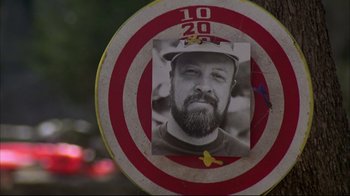 Movie still from “Piranha” (1978), directed by Joe Dante – A black and white photo of a man in a baseball cap; Close Up shot, Low angle