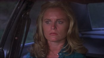 Movie still from “Piranha” (1978), directed by Joe Dante – A person in a car; Close Up shot, Low angle