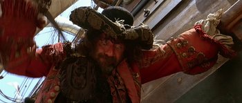 Movie still from “Pirates” (1986), directed by Roman Polanski – A person wearing a pirate hat; Medium shot, Low angle