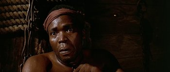 Movie still from “Pirates” (1986), directed by Roman Polanski – A person with a bandage on his head; Close Up shot, Low angle