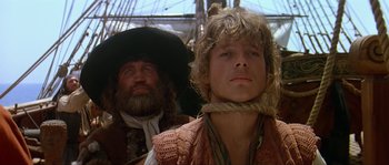 Movie still from “Pirates” (1986), directed by Roman Polanski – A man and a woman in pirate costumes; Close Up shot, Low angle