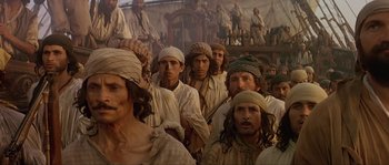 Movie still from “Pirates” (1986), directed by Roman Polanski – A group of men in white shirts and white hats; Medium shot, High angle