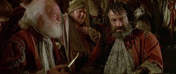 Movie still from “Pirates” (1986), directed by Roman Polanski – A group of men standing next to each other in a room; Close Up shot, Over the shoulder angle